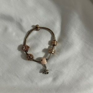 Pandora bracelet size 6.3 and 5 charms included